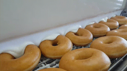 Putting White Chocolate On The Top Of Donuts GIF