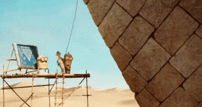Pyramid Being Built In Desert With Ladder GIF