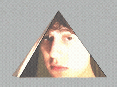 Pyramid With Person's Face Reflection GIF