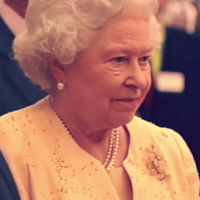 Queen Elizabeth Ii Is Wearing A Yellow Jacket And Pearls GIF