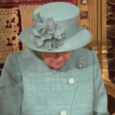 Queen Elizabeth Wearing A Blue Hat And A Blue Coat GIF