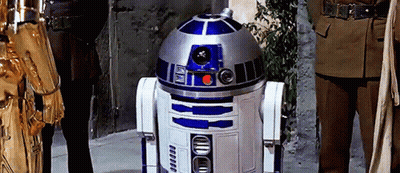 R2D2 Robot Next To Man Statue GIF