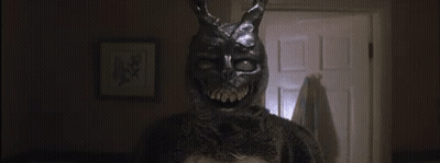 Rabbit Mask Person In Dark Room GIF