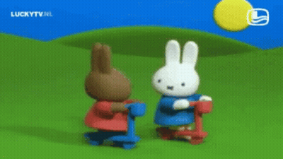 Rabbits Standing Next To Each Other On Scooters GIF