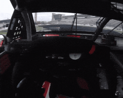 Race Car Dashboard With Red Triangle And Clock GIF