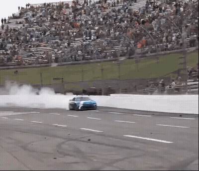 Race Car Drifting On Track With Crowd GIF