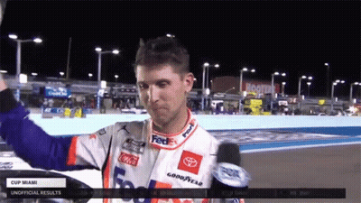 Race Car Driver In FedEx Jersey Holding Up Hand GIF