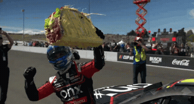 Race Car Driver Taco Over Head Coca Cola Banner GIF