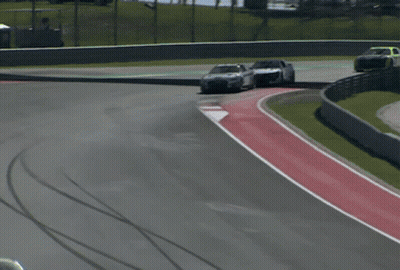 Race Car Driving Down Track GIF