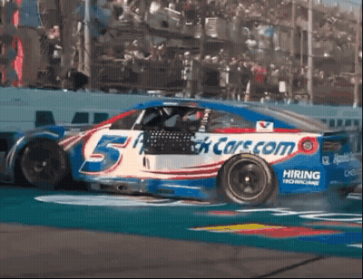 Race Car Number 5 Driving Down Track GIF