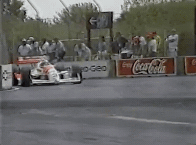 Race Car On Track With Coca Cola Sign GIF