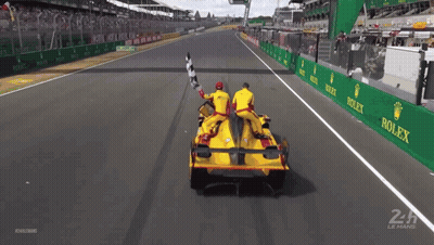 Race Car On Track With Rolex Ads GIF