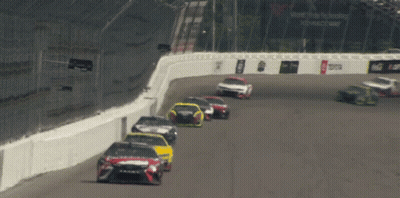 Race Cars On Track With Vote Tobacco Sign GIF