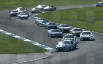 Race Cars Racing On Track With Number 5 GIF