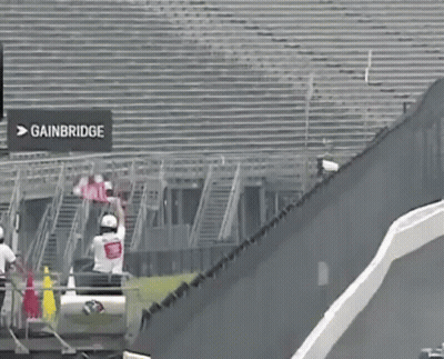 Race Track With Gainbridge Sign GIF