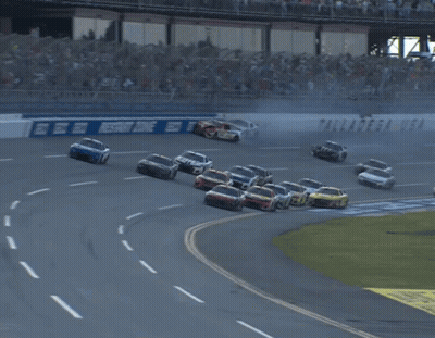 Race Track With Geico Sign GIF