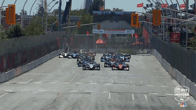 Racing Cars Going Down Track GIF