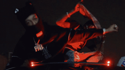 Raiders And Chiefs Football Players Standing Together GIF
