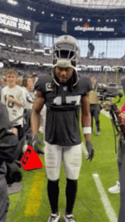 Raiders Player With Swords GIF