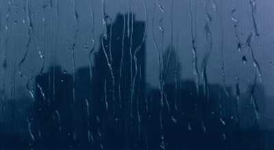 Rain Drops On Window With City Skyline GIF