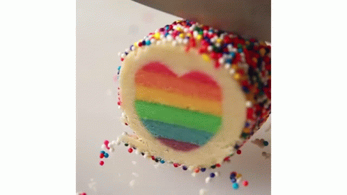 Rainbow Cake With Heart Cut Out And Sprinkles GIF