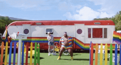 Rainbow Outfit Man In Front Of Trailer Saying I Love You To The Sky GIF