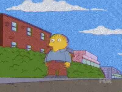 Ralph From The Simpsons Standing On Sidewalk GIF
