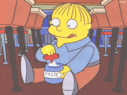 Ralph Wiggum Sitting On The Floor Eating Paste GIF