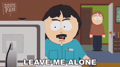 Randy From South Park Is Sitting In Front Of A Computer With The Words Leave Me Alone Below Him GIF