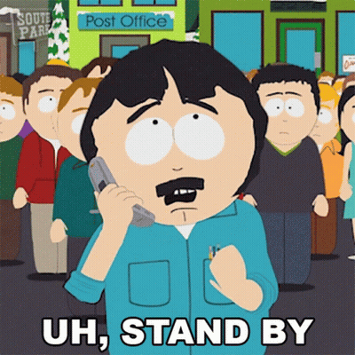 Randy From South Park Is Talking On A Cell Phone And Says " Uh Stand By " GIF