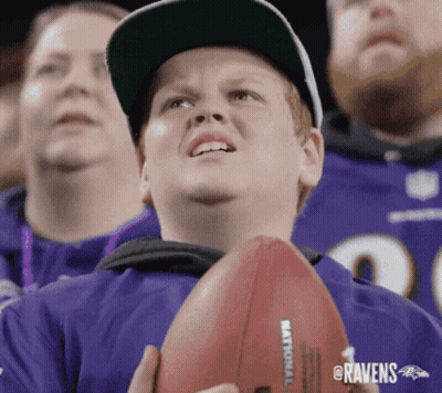 Ravens Fan Holding Football GIF