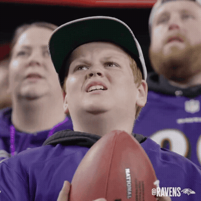 Ravens Fan Holding Football GIF