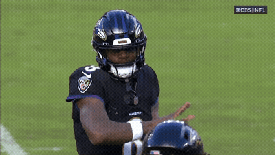 Ravens Football Player Wearing Helmet And Jersey GIF