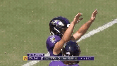 Ravens Football Players High Fiving On Field GIF