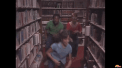 Reading Rainbow Kids Running Inside Library GIF
