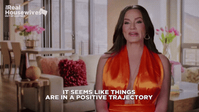 Real Housewives Woman In Orange Dress GIF