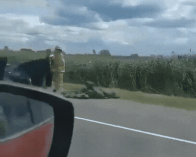 Rear View Mirror Fireman On Road GIF