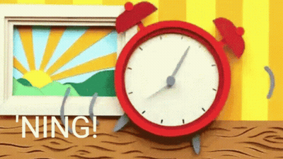 Red Alarm Clock Next To Sunrise Photo GIF