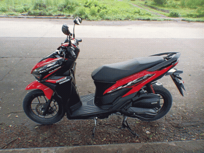 Red And Black Honda Scooter Parked GIF