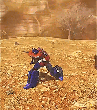 Red And Blue Robot Standing In Desert GIF