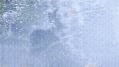 Red And Green Mask Superhero In Rain GIF