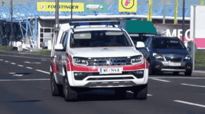 Red And White Car With License Plate WE 164 A GIF