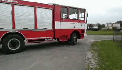 Red And White Fire Truck Parked GIF