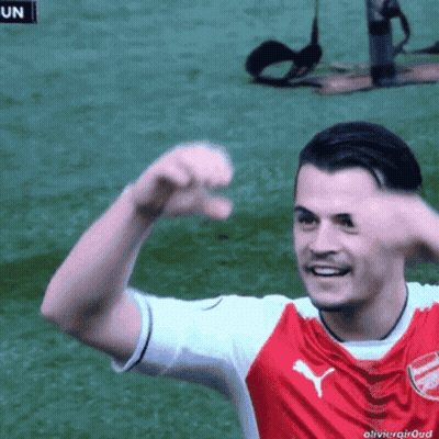 Red And White Puma Jersey Soccer Player Smiling GIF