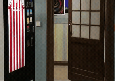 Red And White Striped Door Open To Vending Machine Room GIF