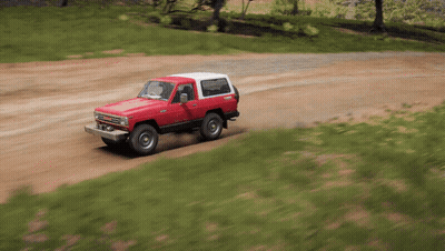 Red And White Truck On Dirt Road GIF