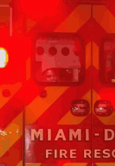 Red And Yellow Ambulance With Miami On Door GIF