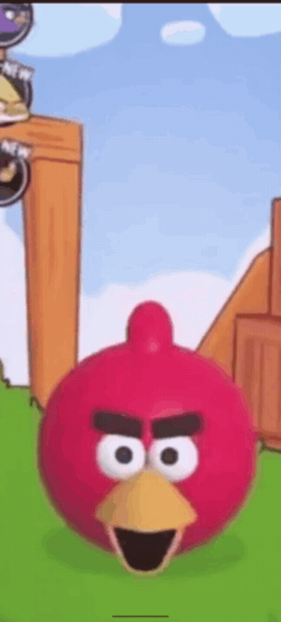 Red Angry Bird With Yellow Beak In Grassy Field GIF