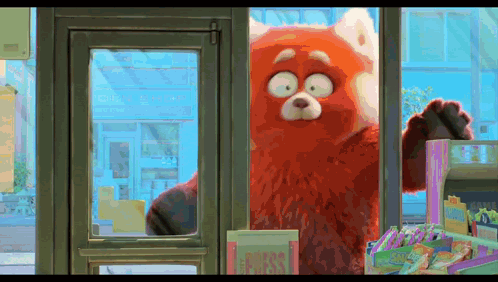 Red Bear Standing In Front Of Store Window GIF