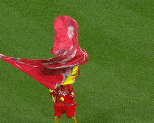 Red Bird Mascot Holding Red Flag GIF